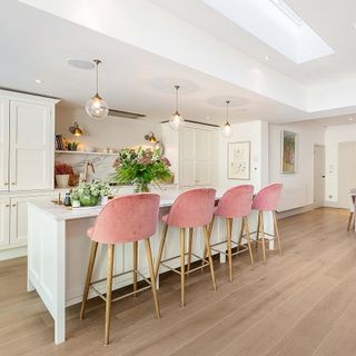 kitchen with wooden flooring and pink chair