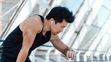 Man checking smartwatch during a run