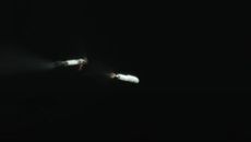 This still from a SpaceX tracking camera video shows the first stage of a Falcon 9 rocket as it separates from its upper stage during SpaceX's launch of the Cosmo-SkyMed Second Generation FM2 satellite for Italy on Jan. 31, 2021 from Cape Canaveral Space Force Station in Florida.