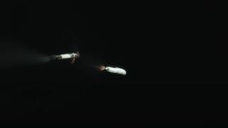 This still from a SpaceX tracking camera video shows the first stage of a Falcon 9 rocket as it separates from its upper stage during SpaceX's launch of the Cosmo-SkyMed Second Generation FM2 satellite for Italy on Jan. 31, 2021 from Cape Canaveral Space Force Station in Florida.
