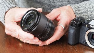 Fujinon XF23mmF1.4 R LM WR in man's hands