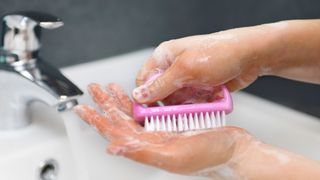 woman washing nails