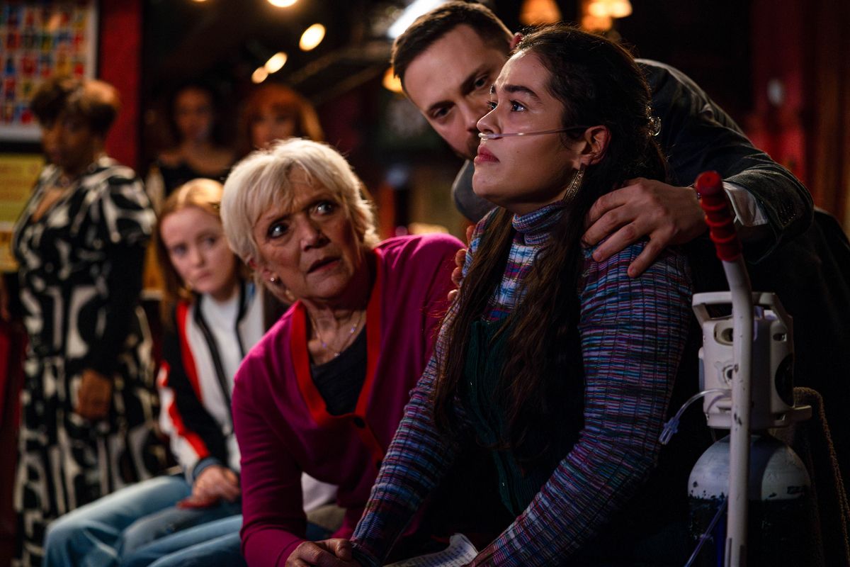 Jean watches over a sick Jade, with Dean in the background in EastEnders 