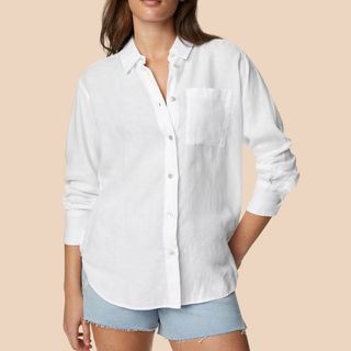 Flat lay image of woman wearing white linen shirt