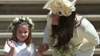 Kate Middleton and Princess Charlotte smile as they arrive at the wedding of Prince Harry and Meghan Markle