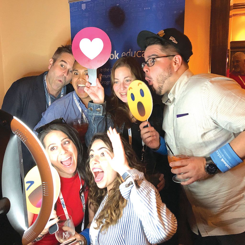The edtech team from New York City ham it up in front of the photobooth.