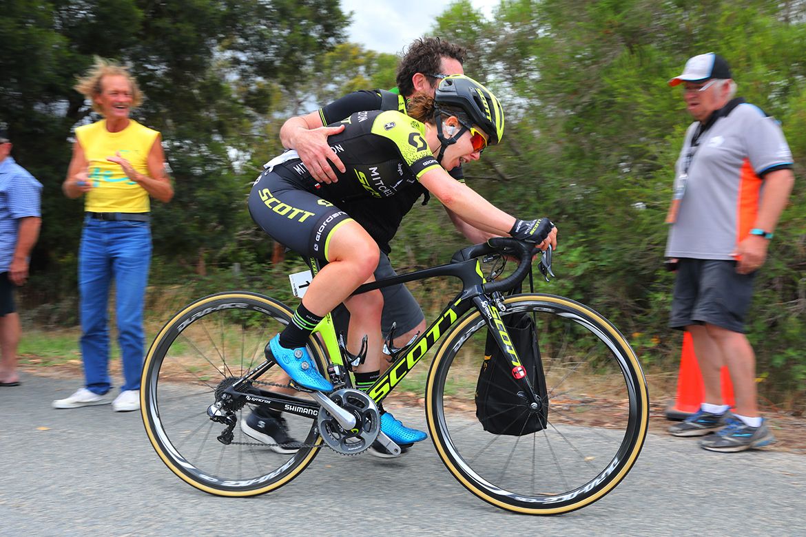 Amanda Spratt (Mitchelton-Scott) gets a helping hand after her stage win