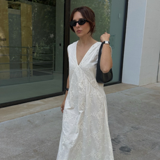 Influencer wearing white nightgown dress.