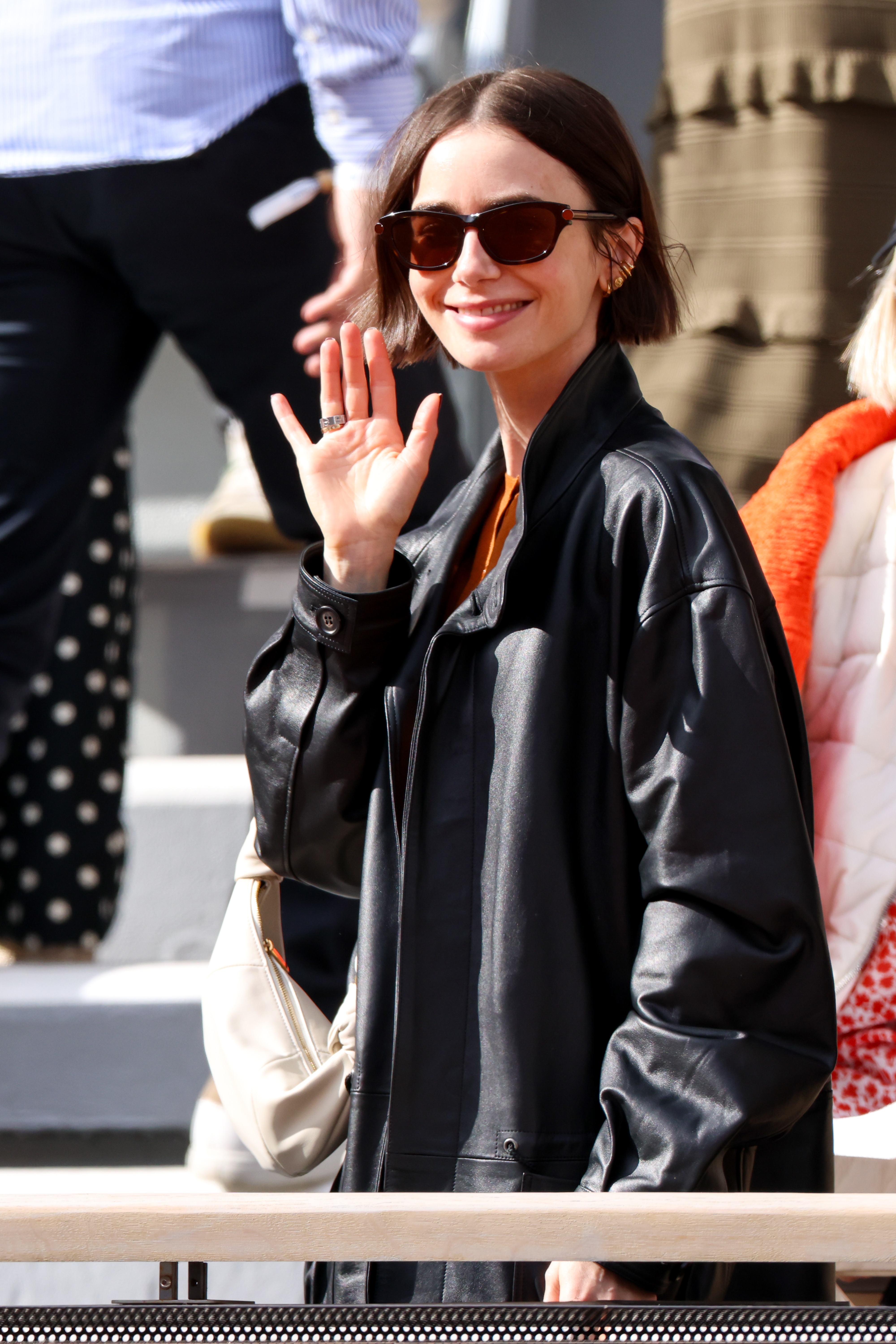 Lily Collins was spotted at the 2026 French Open in an oversize leather jacket