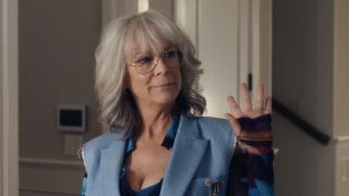 Jamie Lee Curtis waving in Freakier Friday after the body swap. 