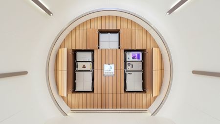 A mockup of a private space shuttle with different compartments for key areas in the overall round structure