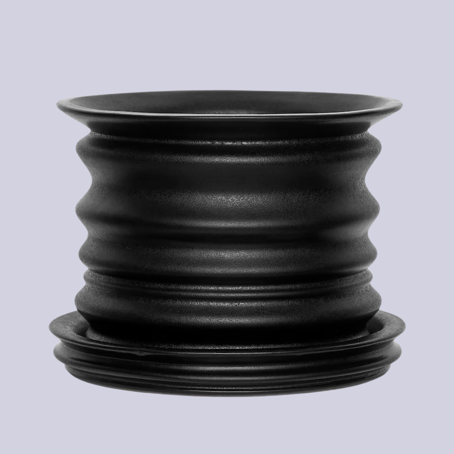 A black textured pot and planter