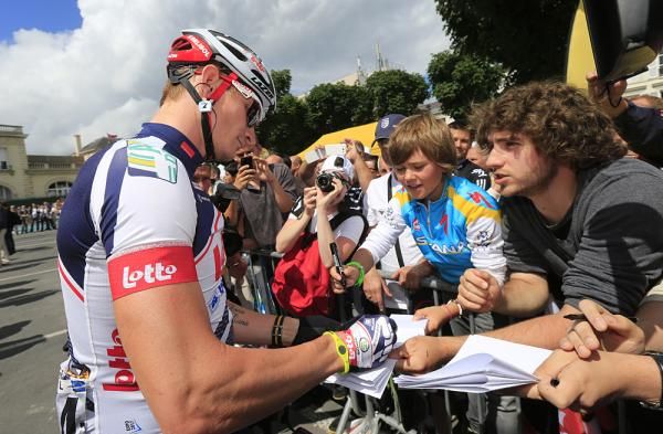 Andre Greipel signs autographs for the fans