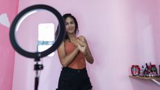 Woman filming herself recording a TikTok