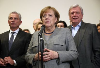 German Chancellor Angela Merkel addresses the media