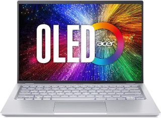 a silver laptop with a logo on the screen