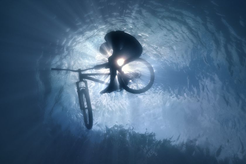 A photograph by Volodya Voronin of a BMX rider submerged in water