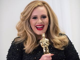 Adele wears a black sequin dress at the Oscars