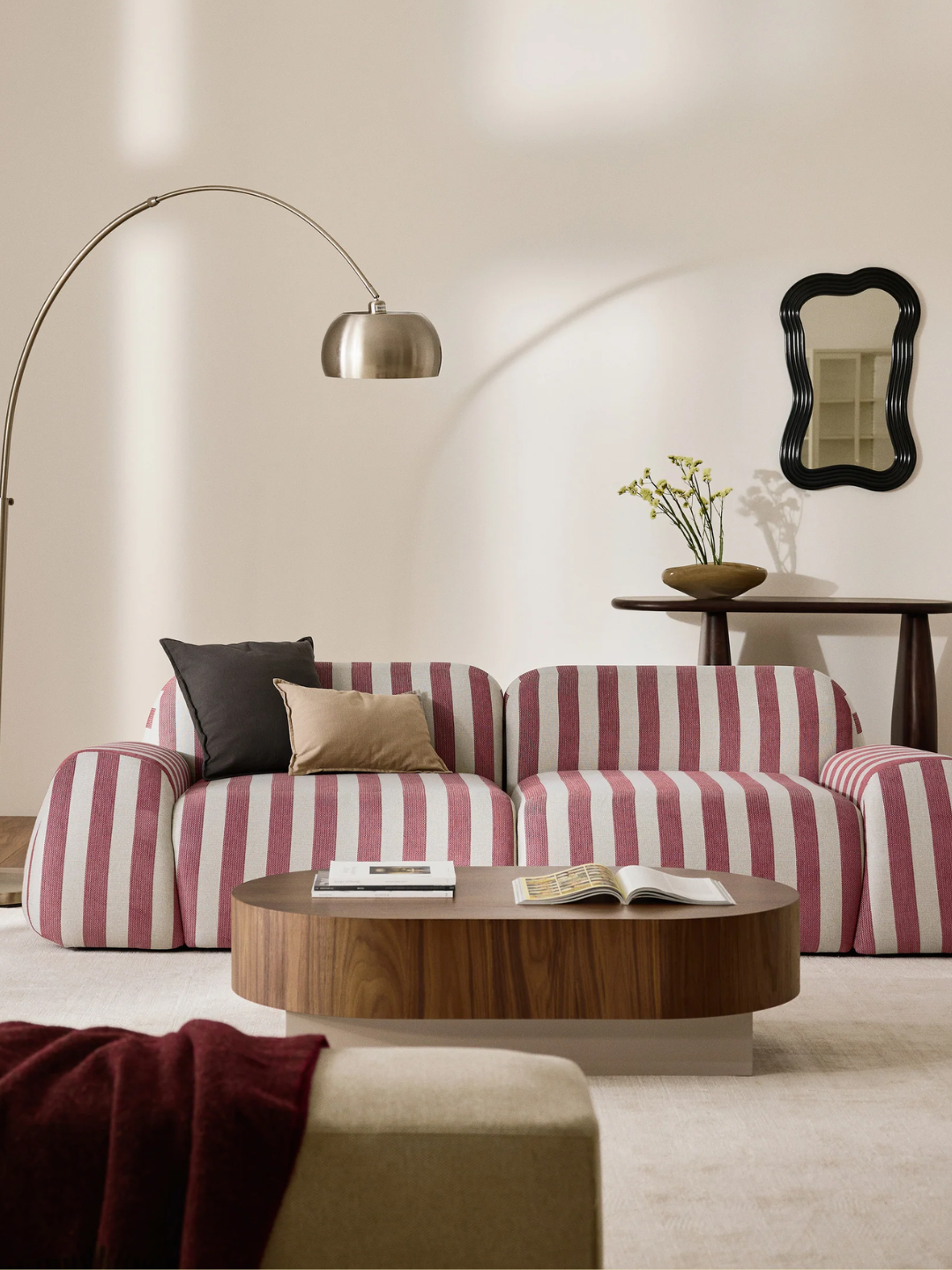 A striped modular sofa from Westwing styled in a modern living room