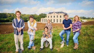 Sarah Beeny posing in the countryside