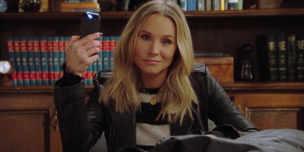 Veronica Mars at a desk, taser at the ready