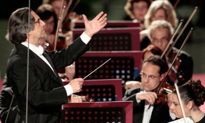 Leader of the pack: Riccardo Muti conducts his orchestra during a concert at the Vatican in May.