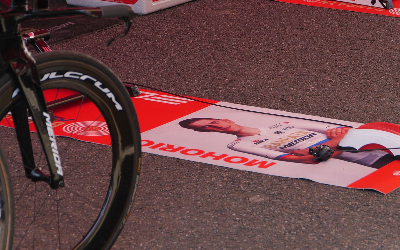 Bahrain-Merida have custom turbo trainer mats for each rider, presumably so they know which bike is there's when warming up
