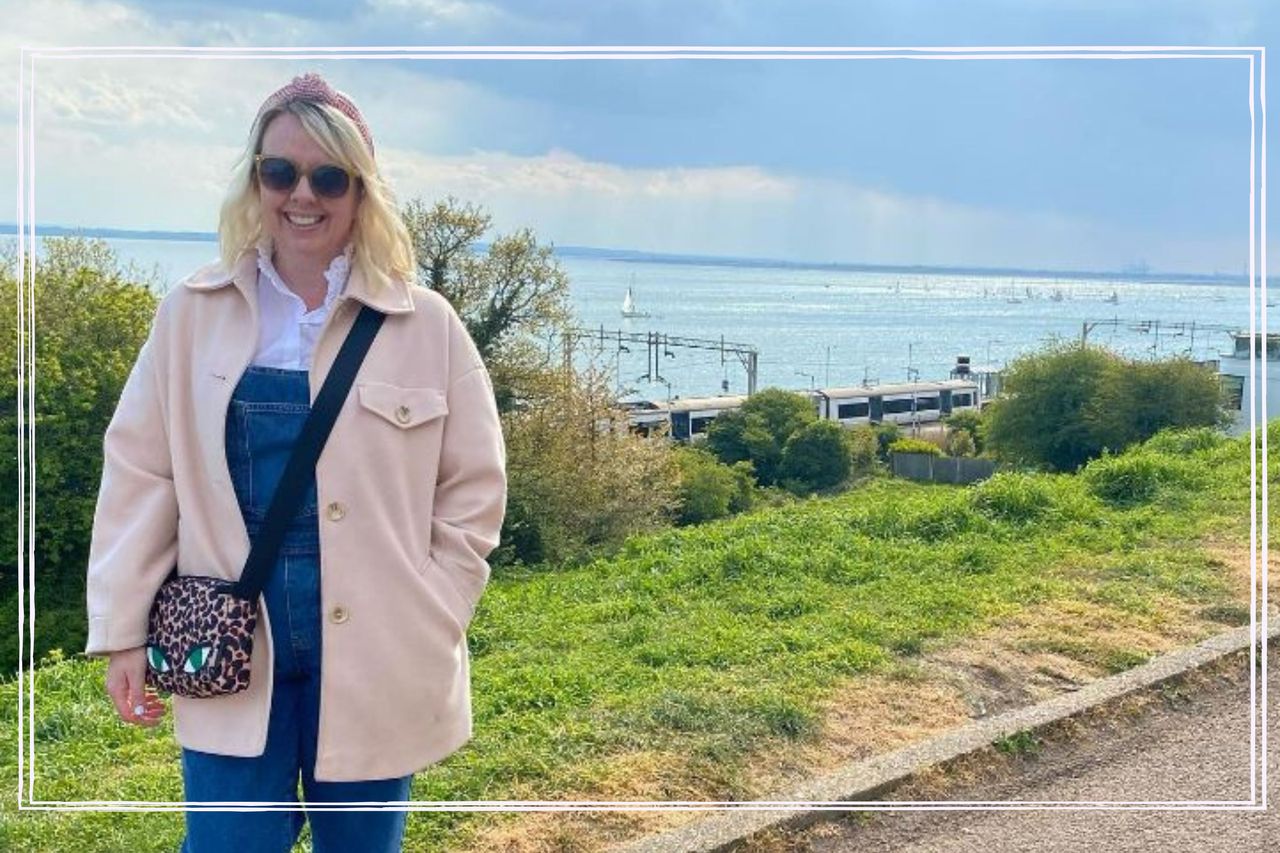 Random act of kindness illustrated by woman stood infront of beach backdrop