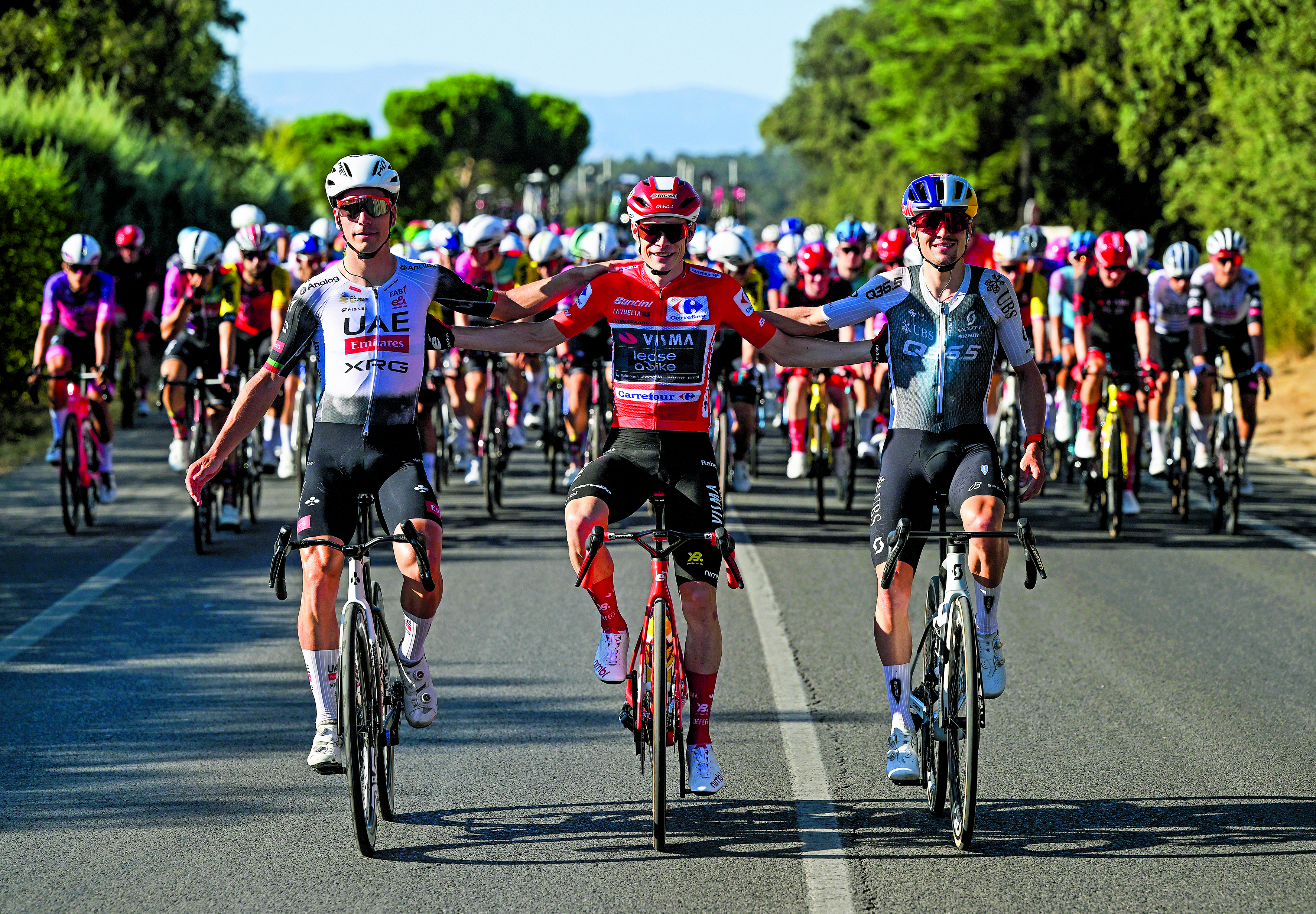 Joao Almeida, Jonas Vingegaard and Tom Pidcock arm in arm