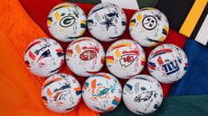 a selection of TaylorMade NFL golf balls showing the teams logos