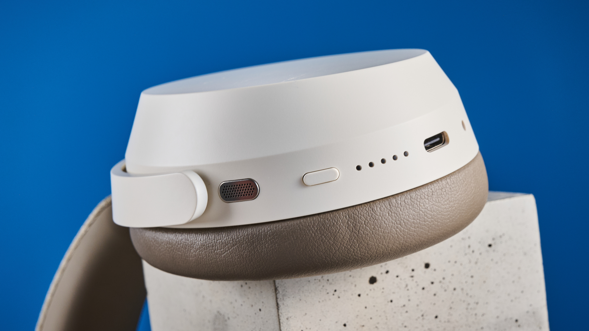 the sennheiser momentum 5 in white photographed against the blue tom's guide background