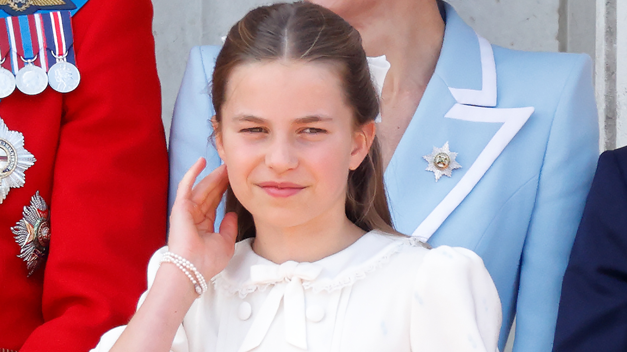 Princess Charlotte of Wales watches an RAF flypast from the balcony of Buckingham Palace after attending Trooping The Colour 2026 on June 13, 2026