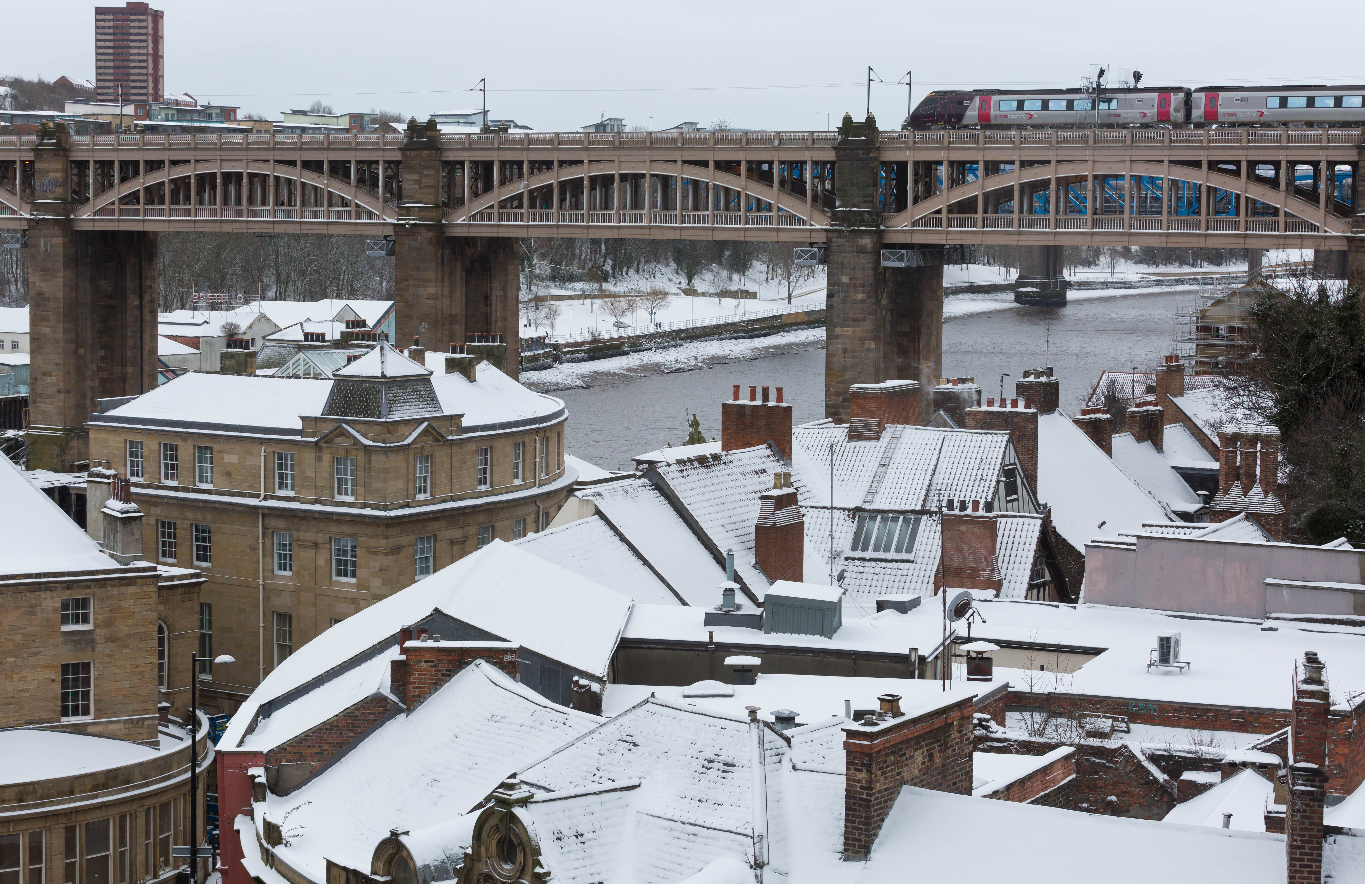 A train waits to pull into Newcastle train station on February 28, 2018 in the snow