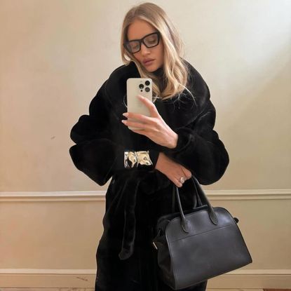 rosie huntington whiteley wears a black nour hammour coat