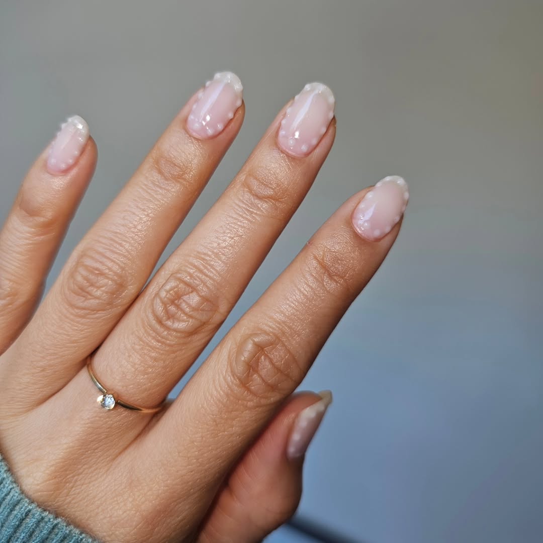 milky nude oval nails with polka dots