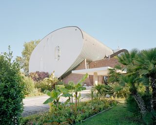 La Cité Oasis, a photographic series on La Grande Motte, shot by Charly Broyez & Laurent Kronental and showing sculptural, white and geometric modernist architecture in the south of france, surrounded by green spaces and in monumental scale