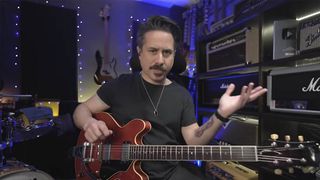 A still from Corey Congilio's Guitar World video lesson in using dominant 7 chords in blues solos.