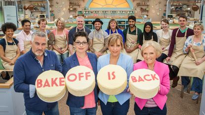 the great british bake off contest with contestants in kitchen