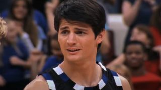 James Lafferty as Nathan in a basketball jersey in One Tree Hill.