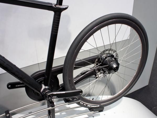 The rear disc rotor and cog are both mounted to the same side of the wheel.