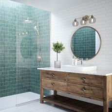 White and turquoise tiled bathroom with wooden vanity unit and walk-in shower