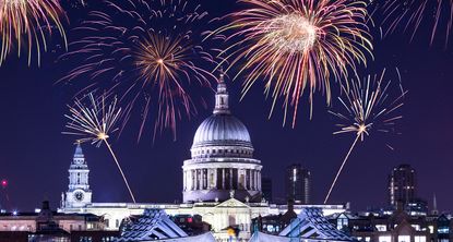 fireworks at night with buildings