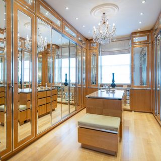 dressing room with wardrobes and chandelier