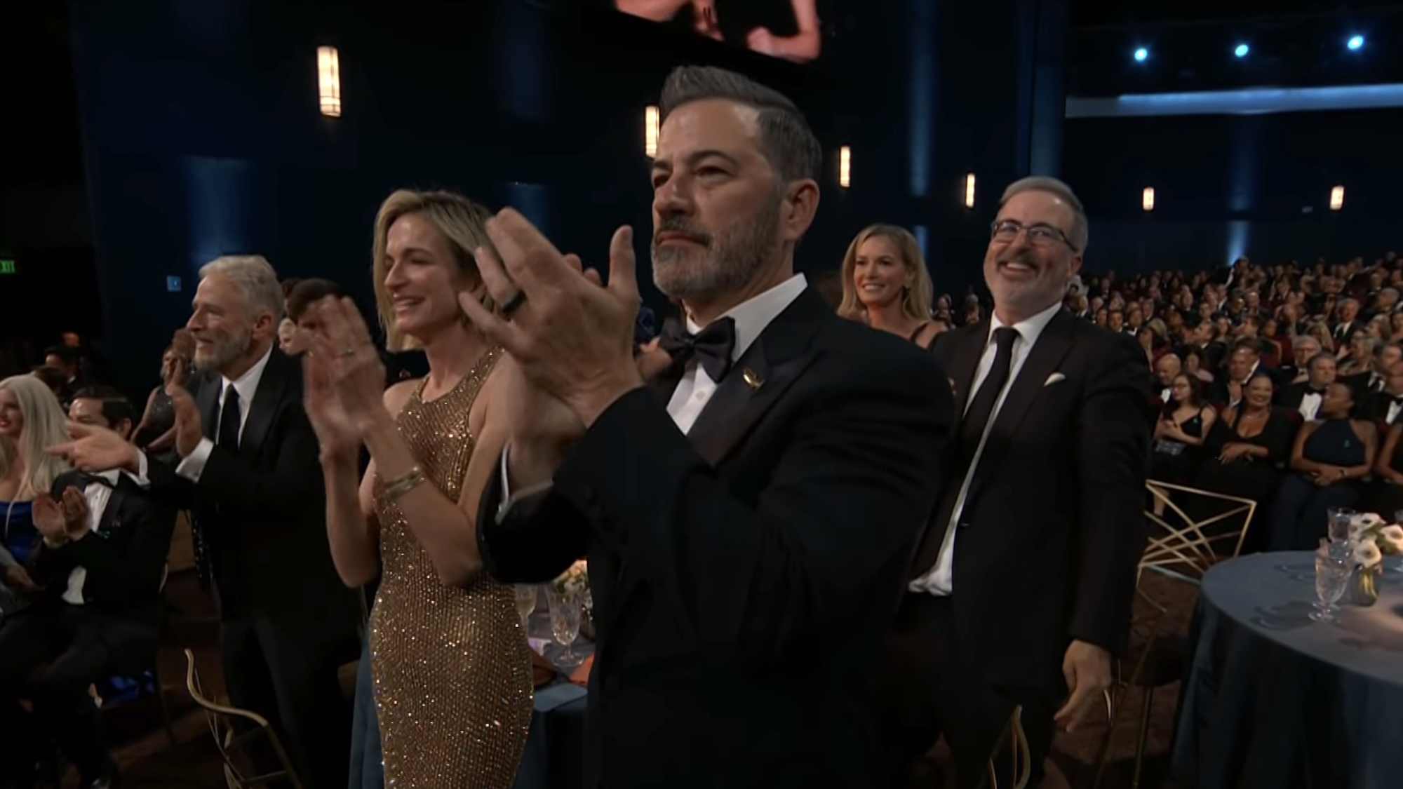 Jimmy Kimmel, John Oliver and John Stewart clapping for Stephen Colbert's win at 2026 Emmys
