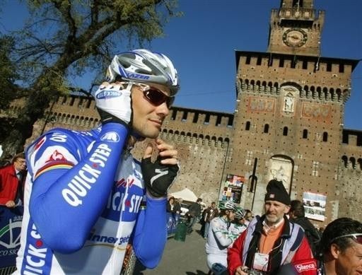 Tom Boonen (Quick Step) checks his batphone is working at the start.
