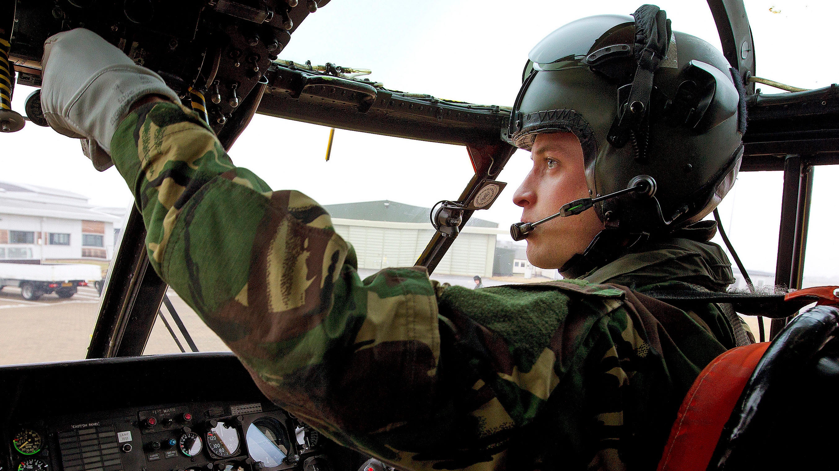 Prince William takes control of his Sea King helicopter at during a training exercise at Holyhead Mountain having flown from RAF Valley on March 31, 2011