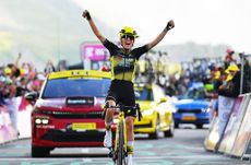Pauline Ferrand-Prévot celebrates victory and her capture of the yellow jersey on the Madeleine