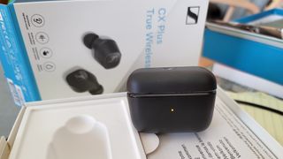The Sennheiser CX Plus charging case being charged via USB-C cable