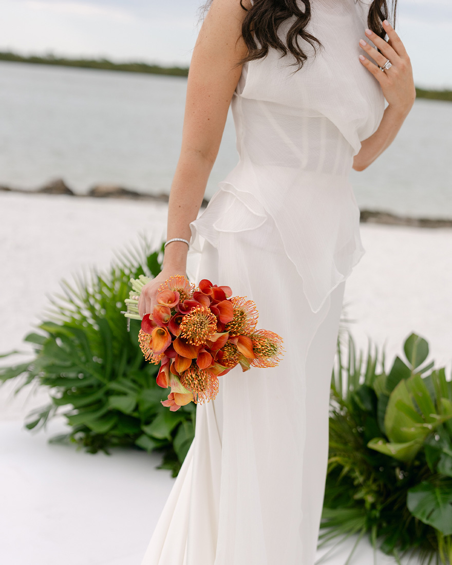 A detailed shot of Kelli Orihuela's wedding outfit.