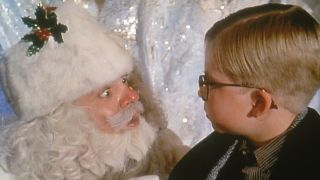 Ralphie (Peter Billingsley) sits on Santa's lap in A Christmas Story